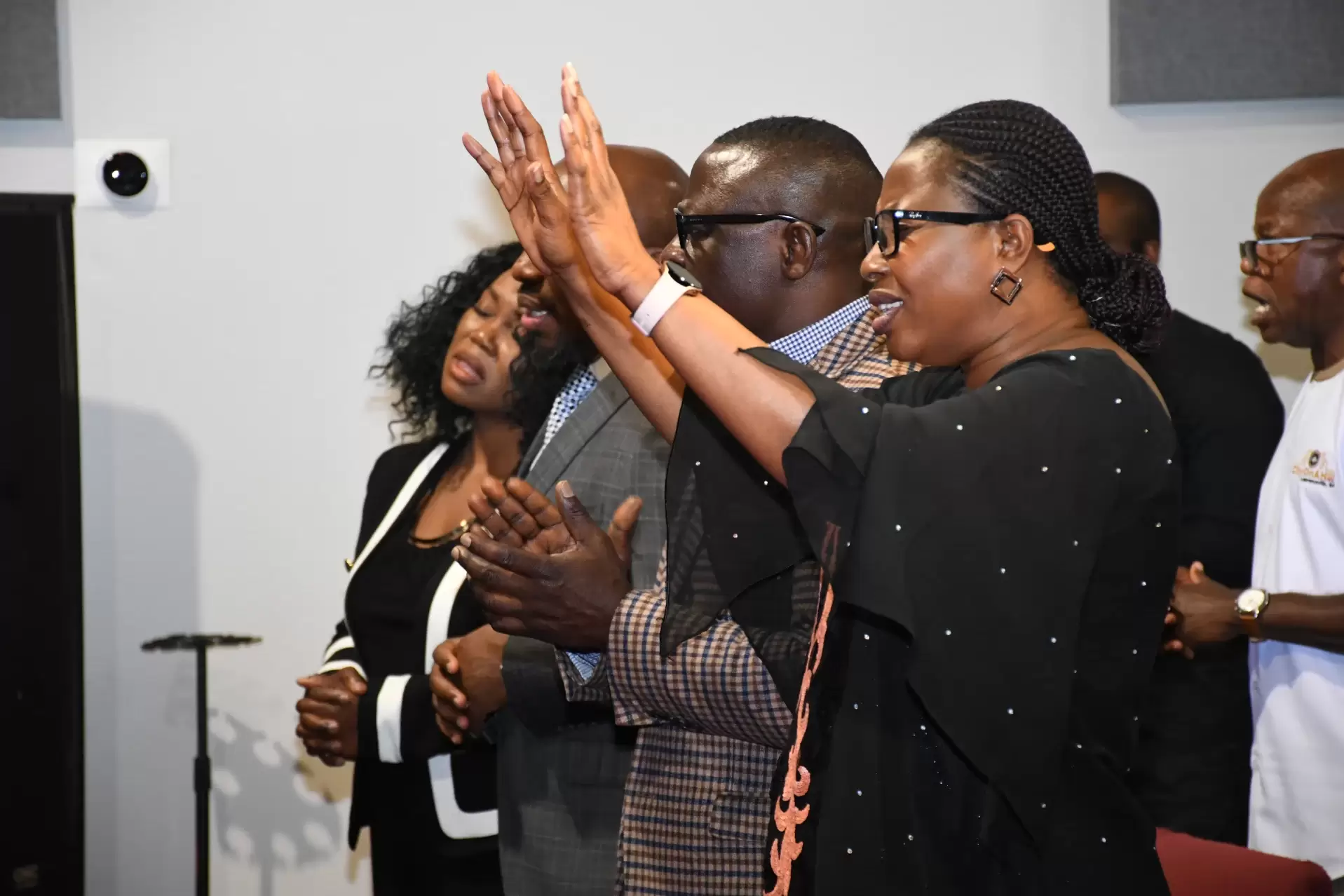 Pastors of RCCG City on a Hill participating in worship during a church service